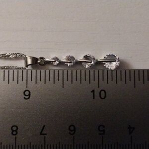 Sterling silver necklace w/ 4 cubic zircons.